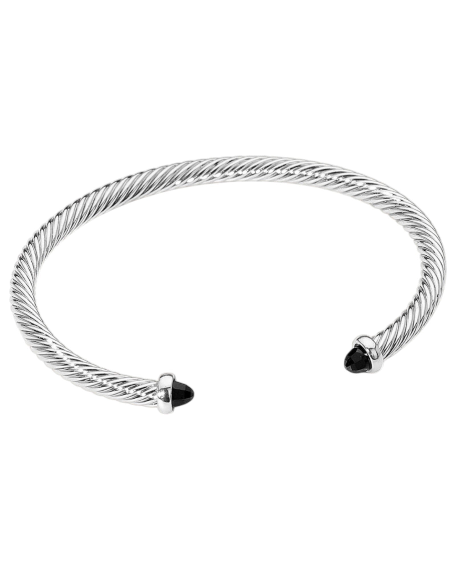 Silver cuff bracelet with black stones on end on a white background.