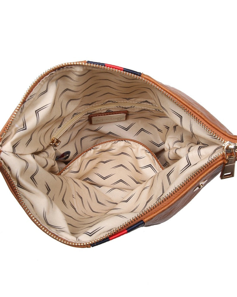 Brown vegan leather fold over clutch bag with sporty navy and red stripe, zipper and gold strap.
