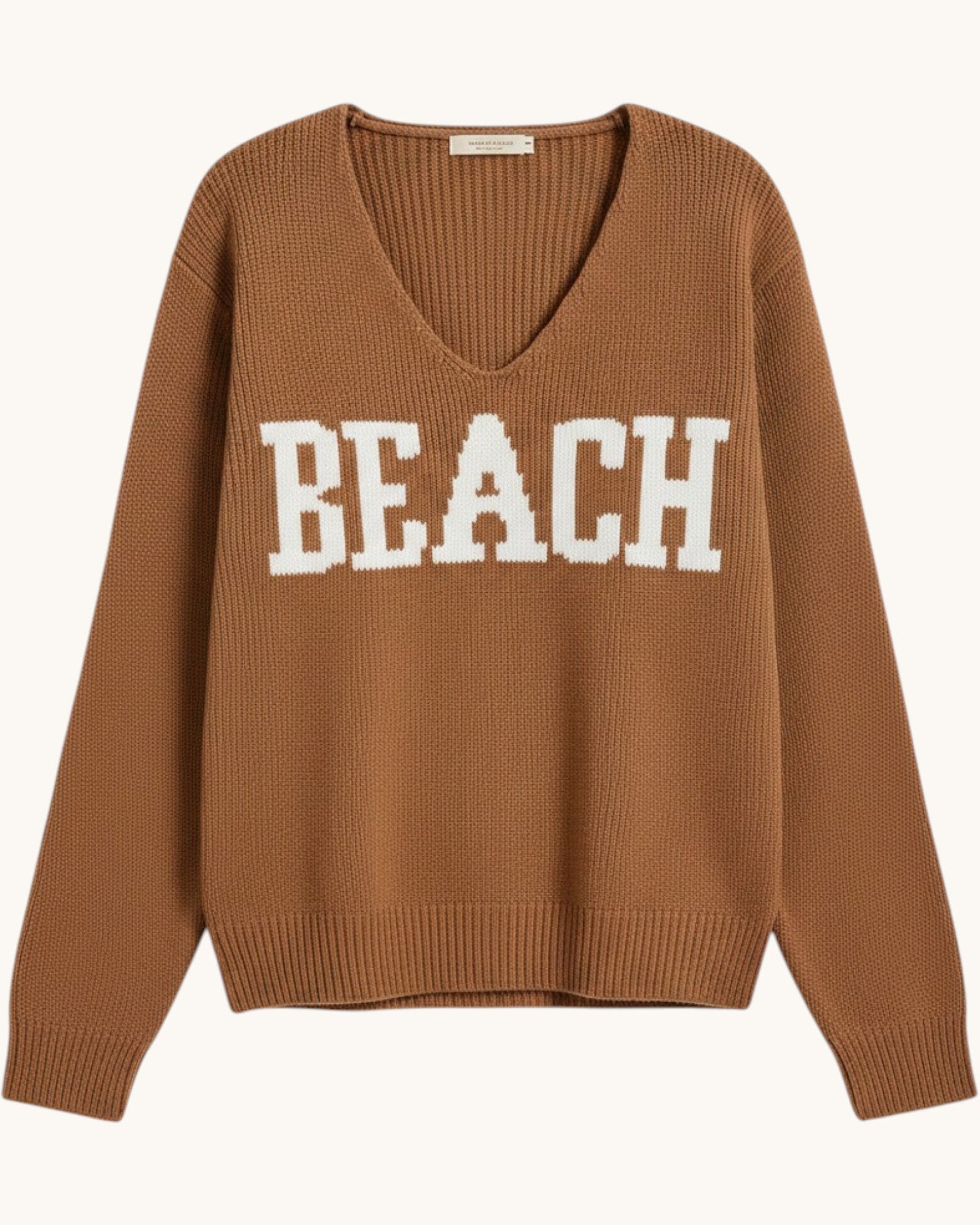 Brown/deep camel  v-neck sweater with 'BEACH' text on a white background.