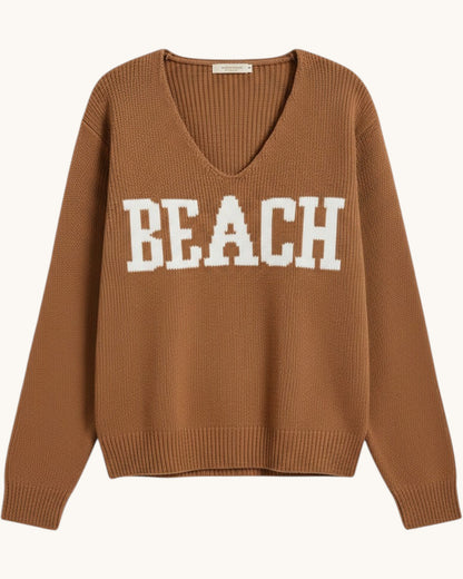 Brown/deep camel  v-neck sweater with 'BEACH' text on a white background.