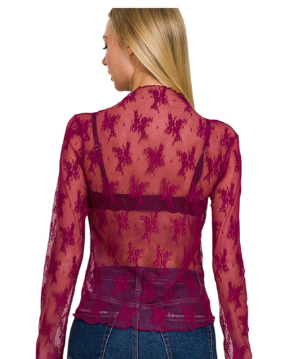Woman wearing a Floral Embroidered Sheer Cranberry Long Sleeve Top.