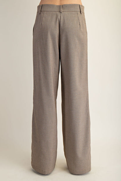 Checkered pants on a beige background.