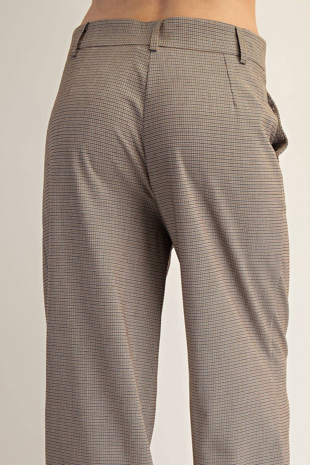 Brown checkered pants on a plain background.