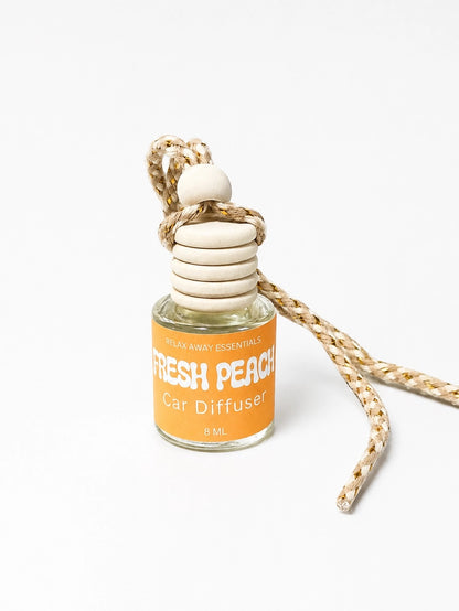 Car diffuser with 'Fresh Peach' label on a white background.