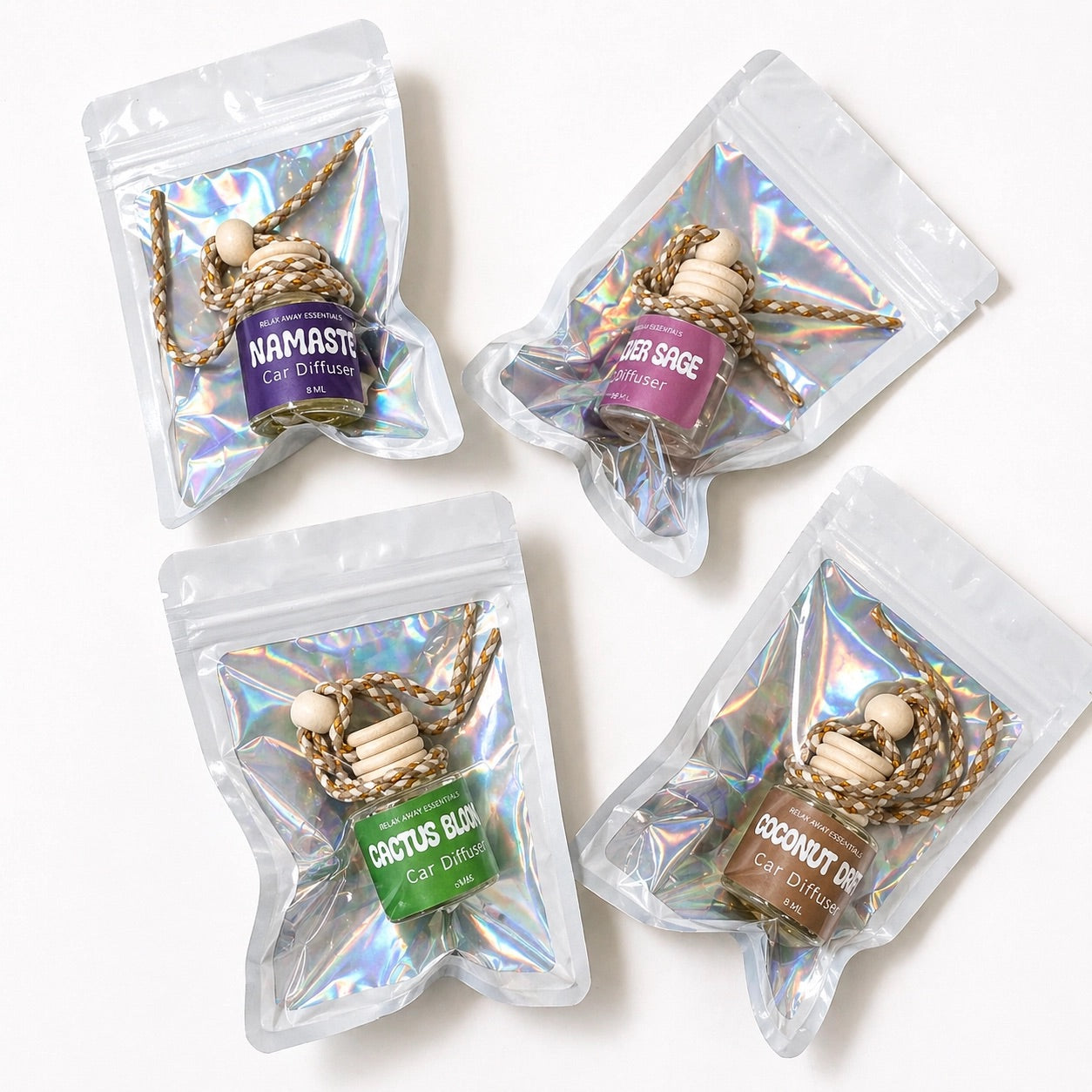 Four car diffuser packages with various scents on a white background.