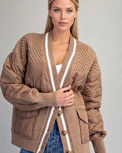 Caramel sweater jacket on model, showing quilted front panels and contrasting ivory-striped trim.