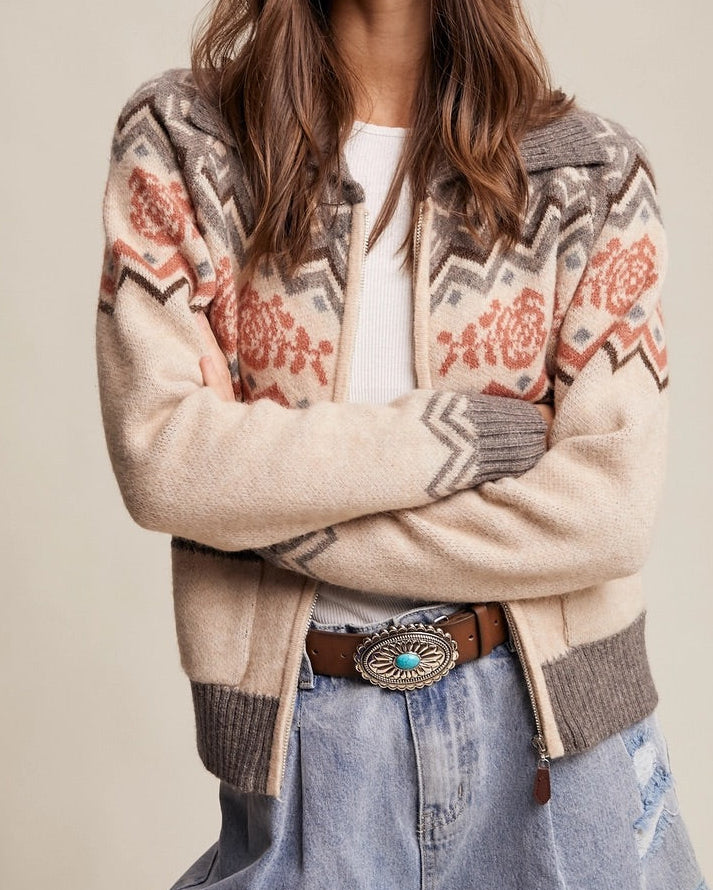 Retro Rose Fair Isle Zip Cardigan in grey, oatmeal, and salmon with floral jacquard  and zigzag pattern with ribbed collar and front pockets.