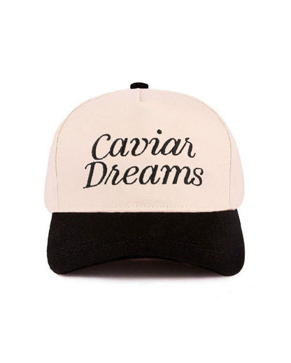 Cap with 'Caviar Dreams' text on a white background.