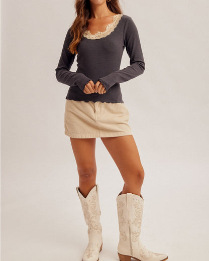Ash ribbed long sleeve top with ivory lace neckline and lettuce edge hem.