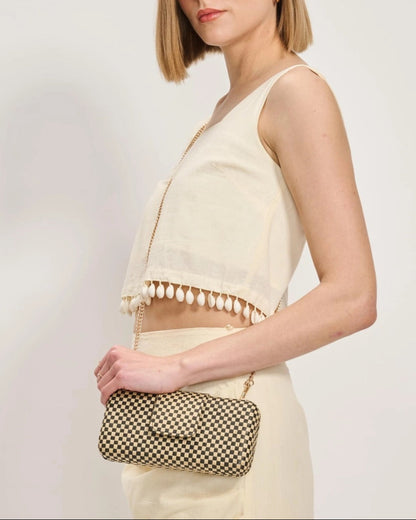 Black and Natural Checkered crossbody bag with chain strap.