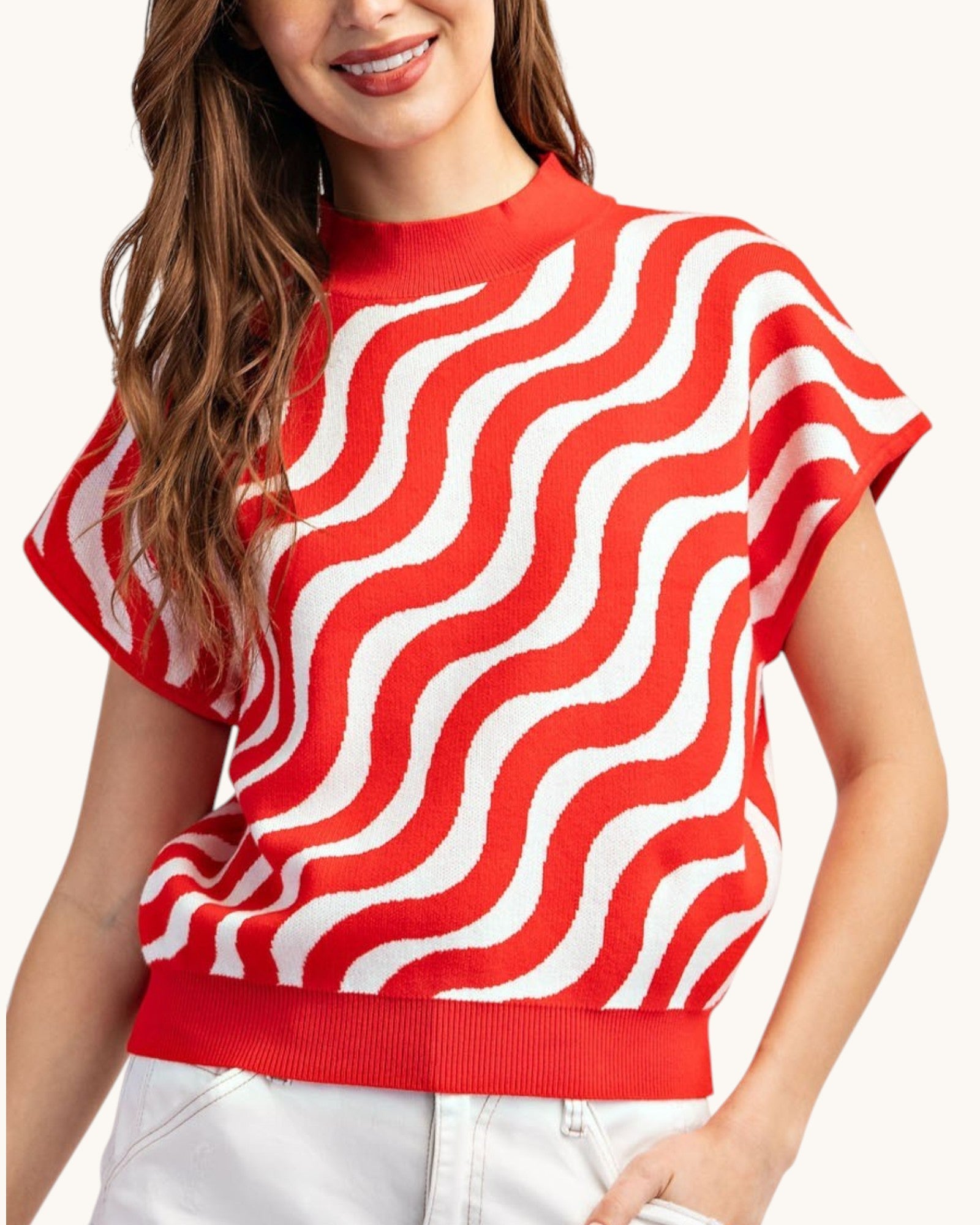Cherry red and white swirl short sleeve summer sweater, front view.
