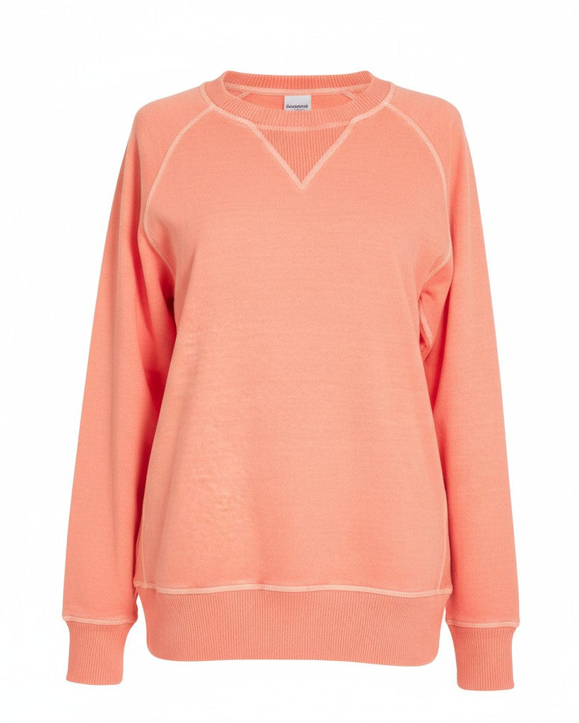 Coral sweatshirt on a white background.