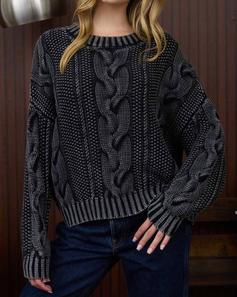 Cotton chunky cable knit sweater in black acid wash. 