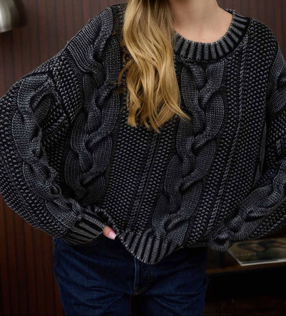 Cotton chunky cable knit sweater in black acid wash. 