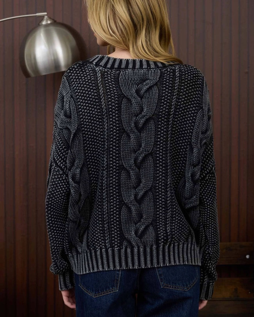 Cotton chunky cable knit sweater in black acid wash. 