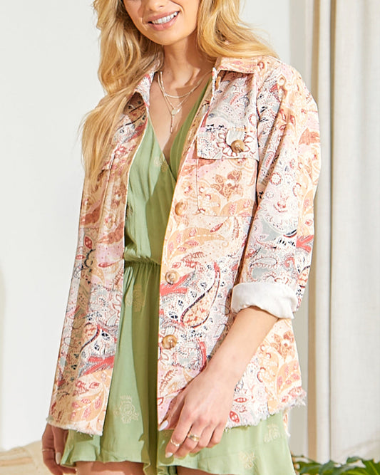 Paisley patchwork shacket with frayed hem and button-up front.