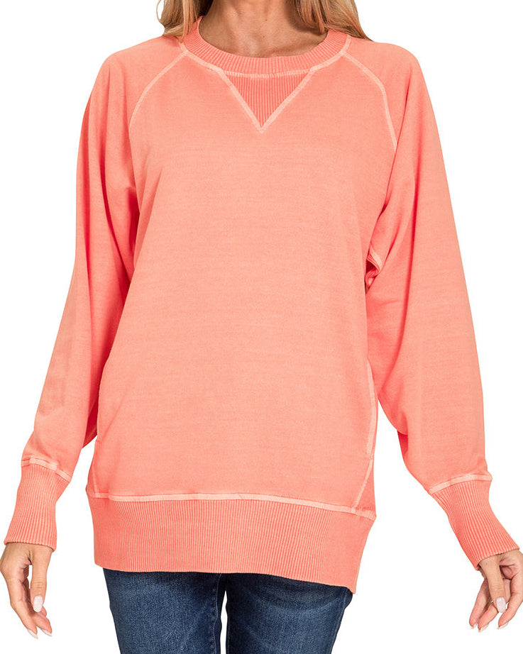 Pigment-dyed 100% cotton French terry pullover in Coral with pockets, ribbed trim, and relaxed, oversized fit. 