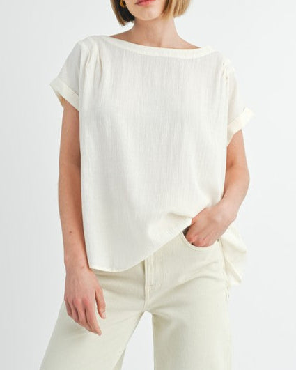 Cream button back dolman sleeve top with relaxed fit.