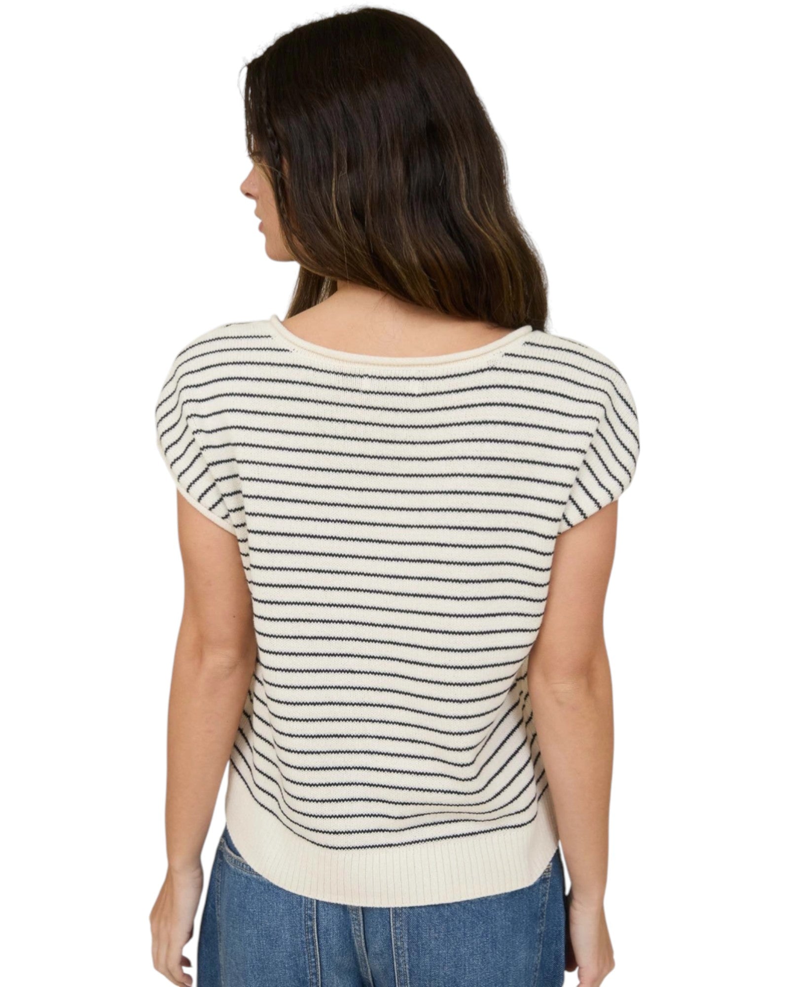 Woman wearing a Cream and Navy striped short sleeve button up cardigan.