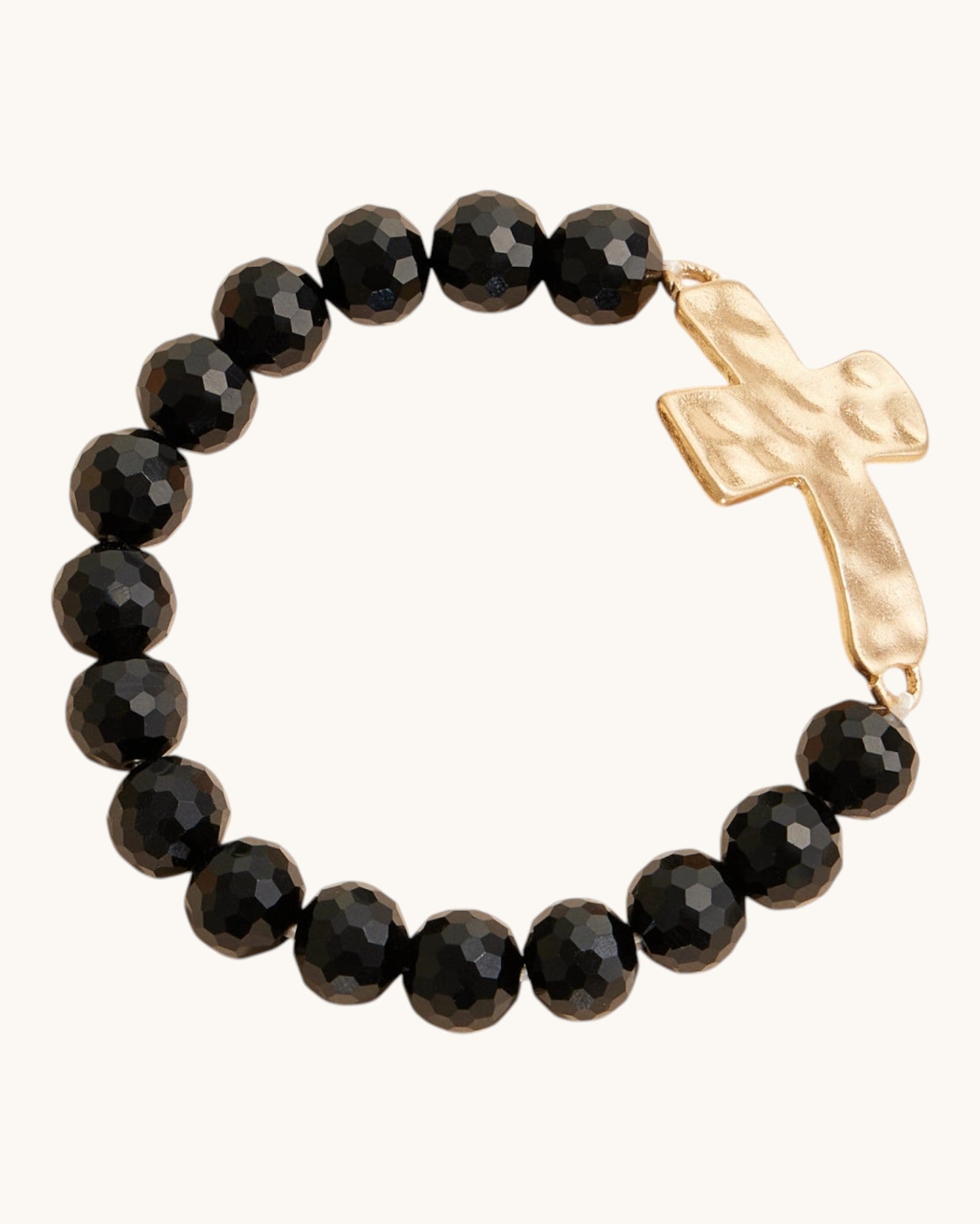 Hammered Gold Cross Glass Bead Stretch Bracelet in Black, featuring large glass beads and hammered gold cross charm.