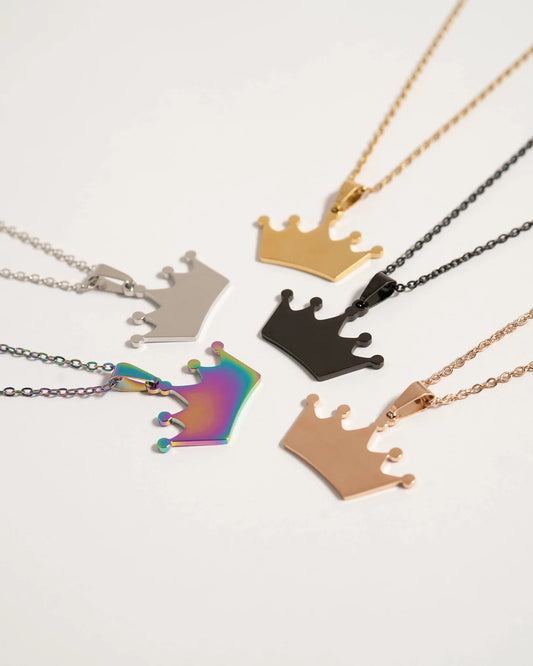 Collection of crown-shaped necklaces in various colors on a white background.