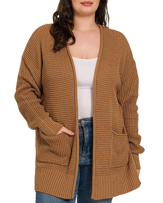 Woman wearing a plus size deep camel waffle knit open cardigan.