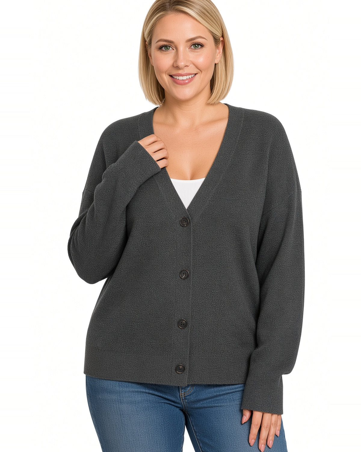 Model wearing a lightly ribbed charcoal button up v-neckline cardigan over a white tee shirt with jeans.