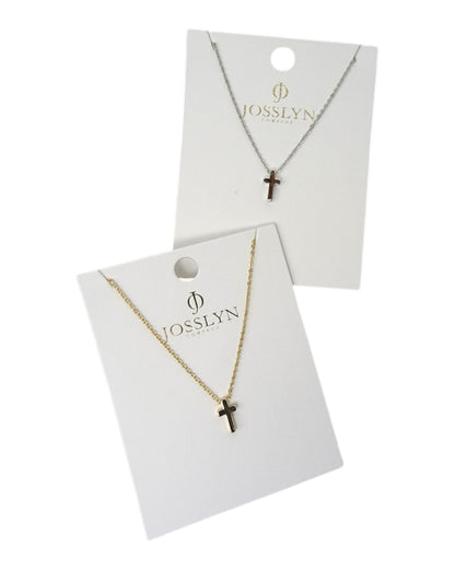 Two necklaces with cross pendants on Josslyn branded cards.