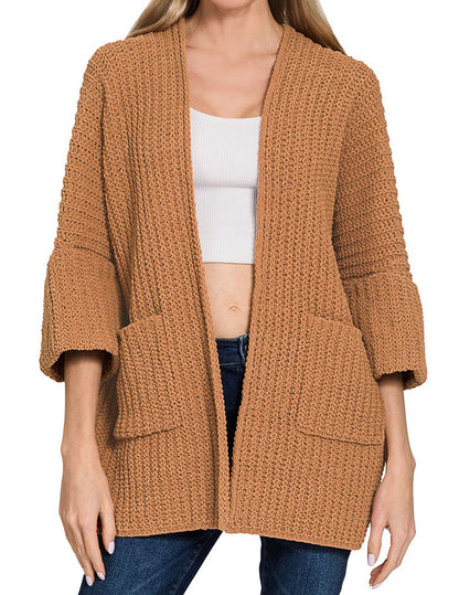 Woman wearing a Deep Camel Chunky Knit Boxy cardigan on a white background.