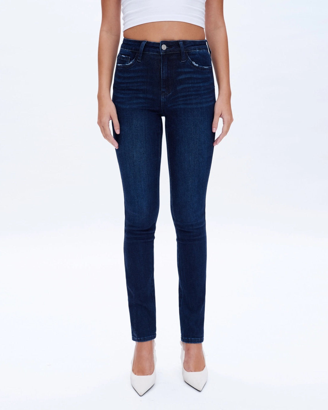 Slim and Straight Super Stretch Mid-Rise Jeans in Deep Sea Blue.