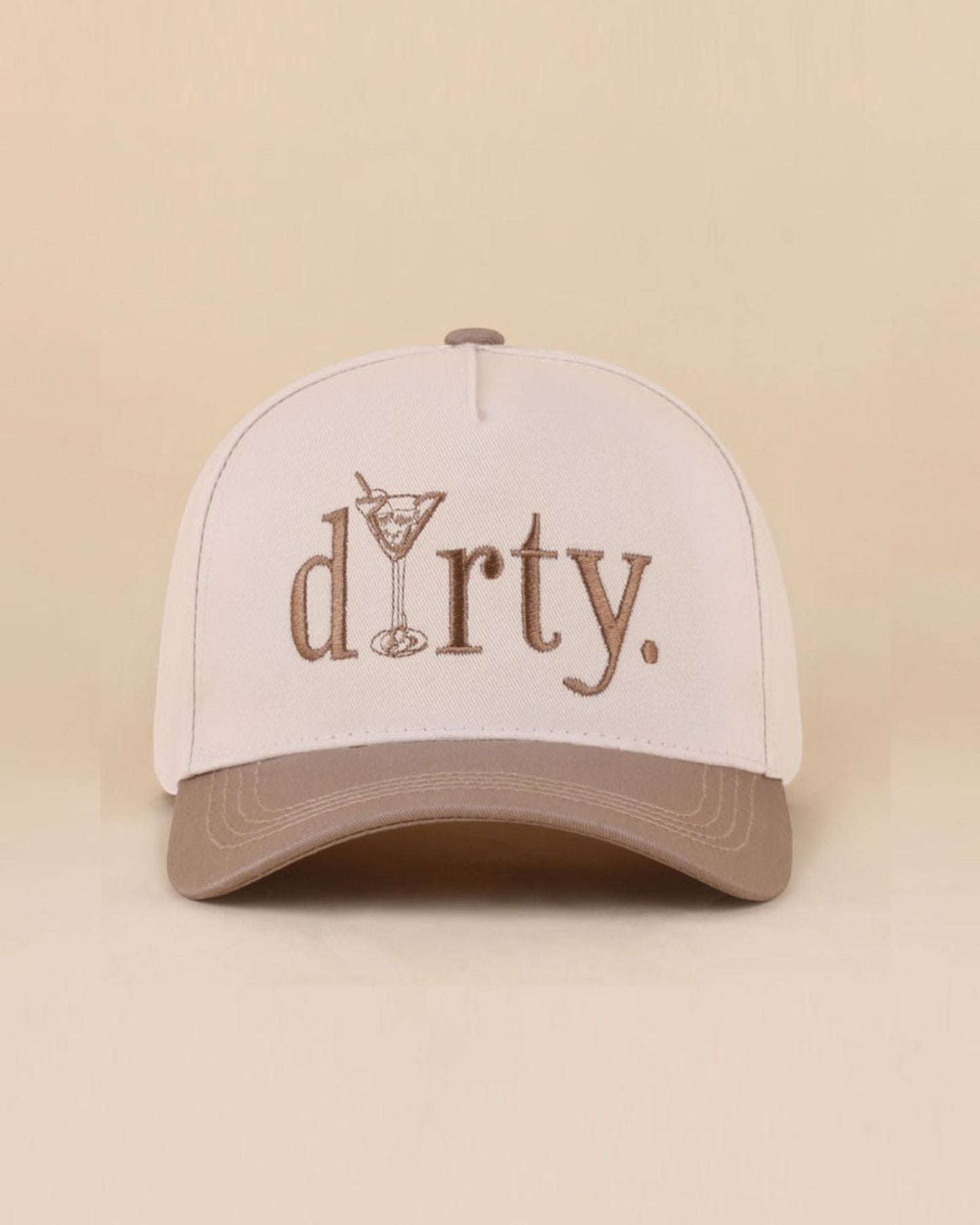 Cap with 'dirty.' text and martini glass design on beige background.