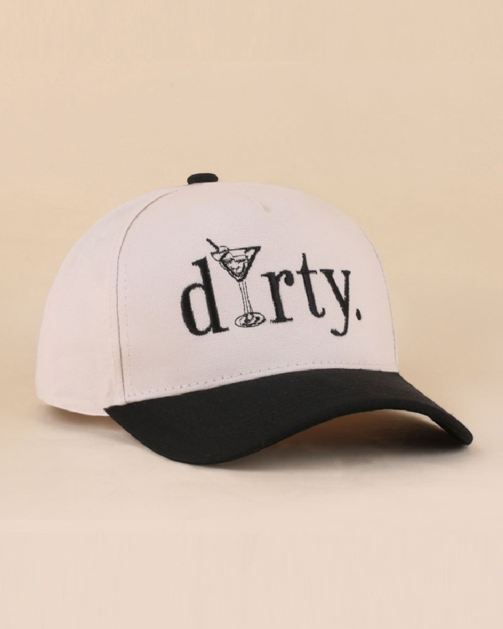 Cream and black cap with 'dirty' text  and a martini class on a beige background.