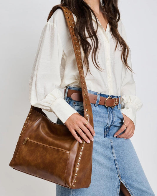 Chocolate studded crossbody bag with front and back zip pockets.
