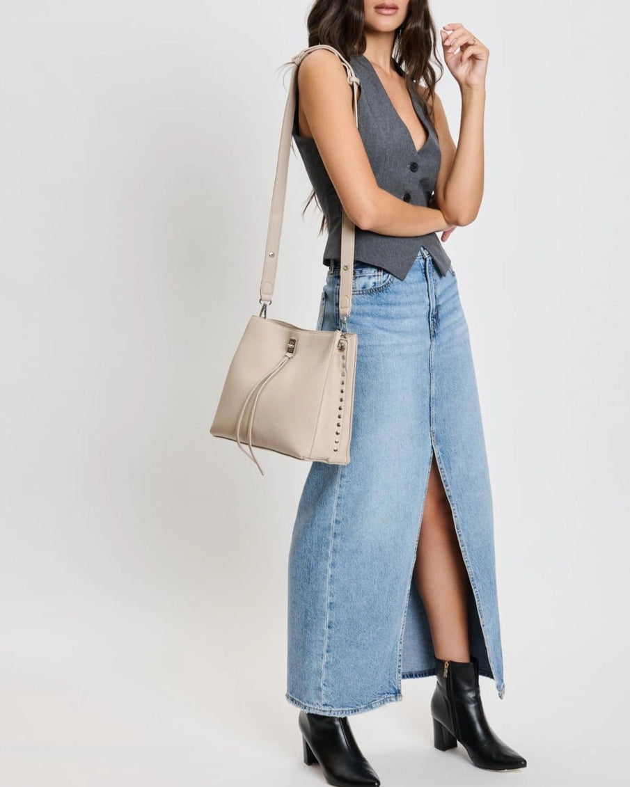 Eliza tassel vegan leather crossbody handbag with studs and turn lock in Almond or Black.