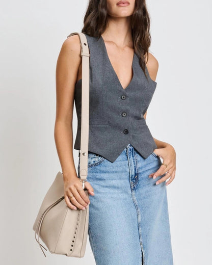 Eliza tassel vegan leather crossbody handbag with studs and turn lock in Almond or Black.