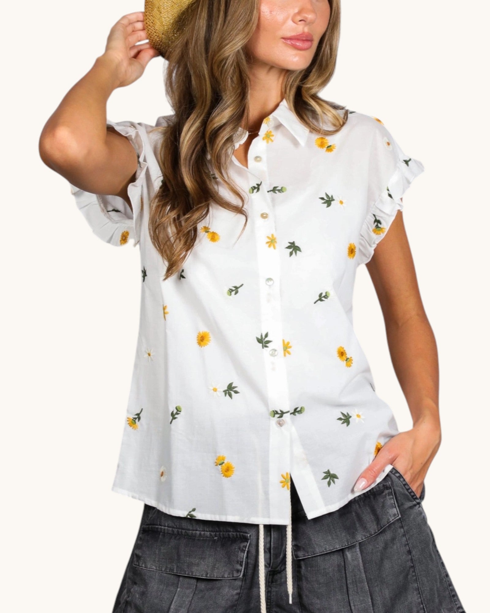 Off-white embroidered cotton top with ruffle cap sleeves and button-front closure