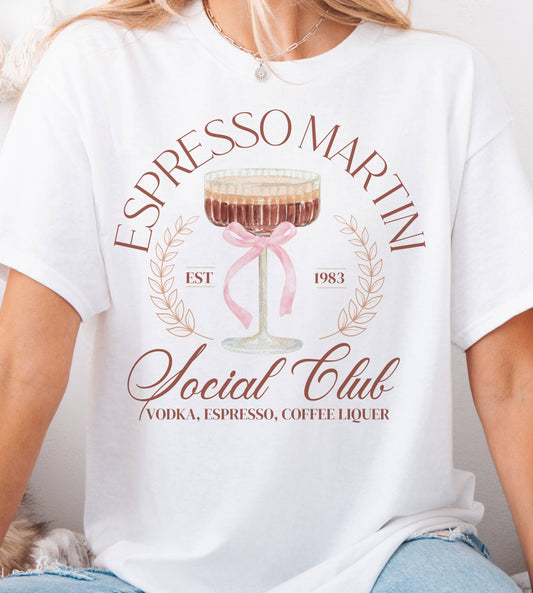 White tee with espresso martini glass and “Social Club” lettering in blush and tan.