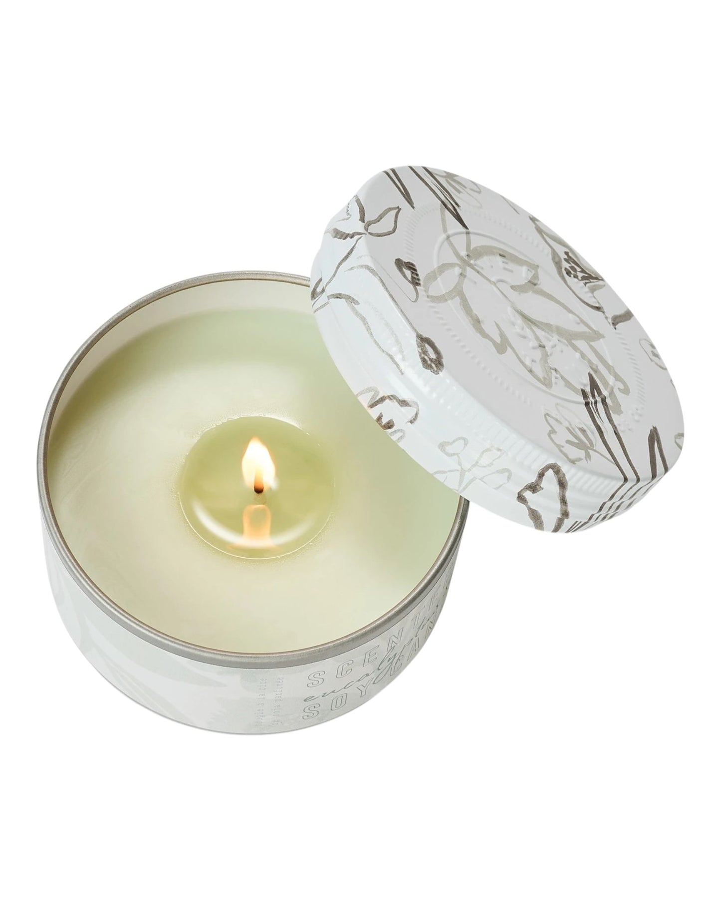 Candle in a tin with a decorative lid on a white background.