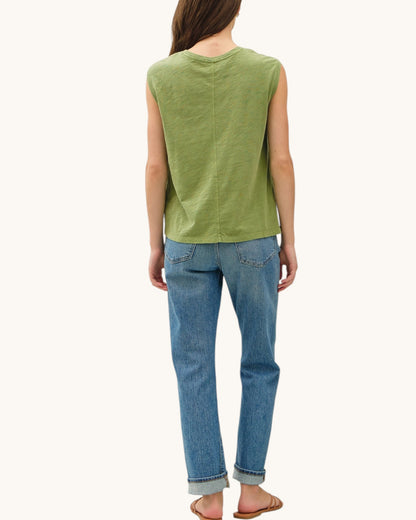Back view of the Fern Essential Cotton Slub Tank Top paired with denim blue jeans.