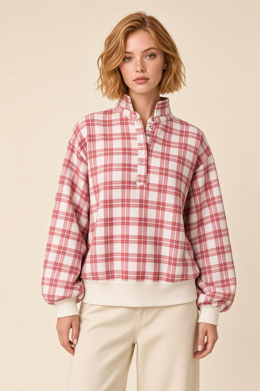 Woman wearing the Fireside Mock Neck Pullover Sweatshirt in Red and Ivory Plaid.