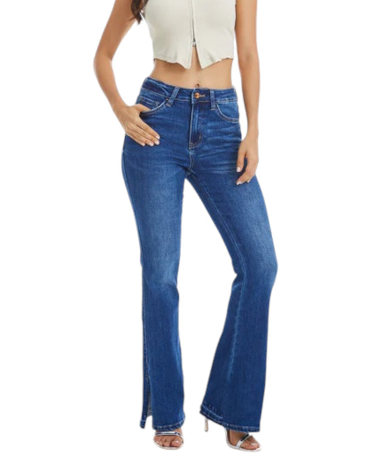 Woman wearing High-Rise Flare Jean with Side Slit in Medium Blue.