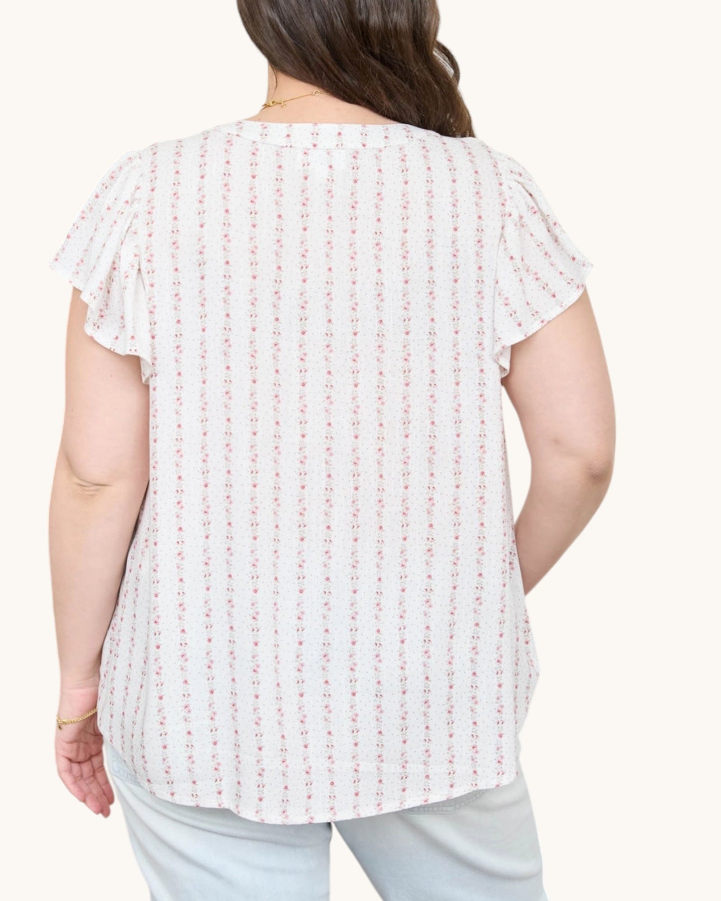Blush Pink Garland Striped Woven Top - white top with delicate pink floral garland striped and v-neckline with ruffle sleeves. Back view.