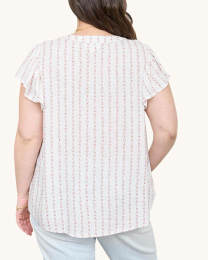 Blush Pink Garland Striped Woven Top - white top with delicate pink floral garland striped and v-neckline with ruffle sleeves. Back view.