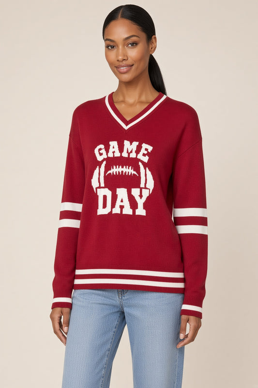 Woman wearing a the Red Varsity Game Day Football Sweater.