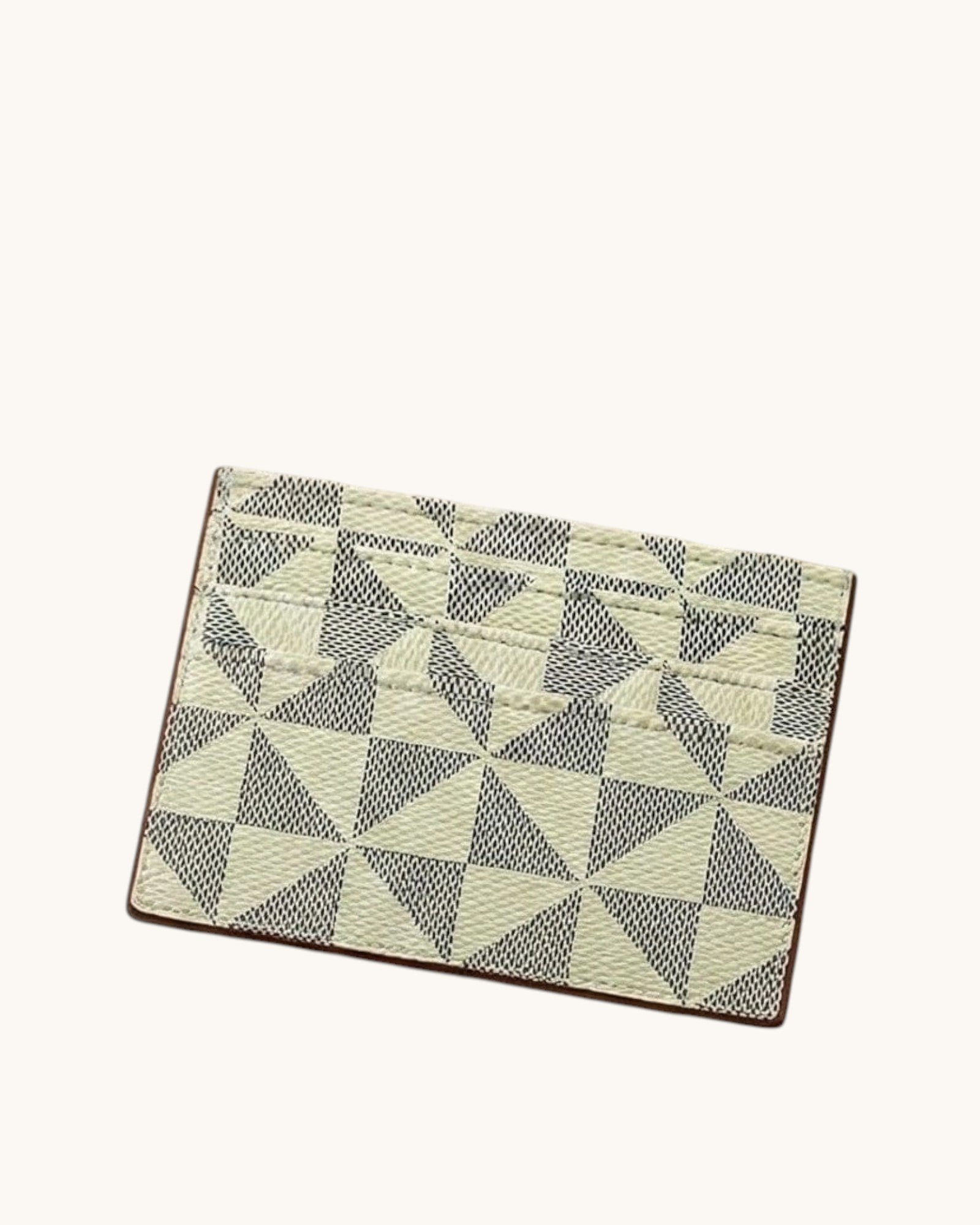 Small card wallet in Ivory with a geometric pattern on a white background.