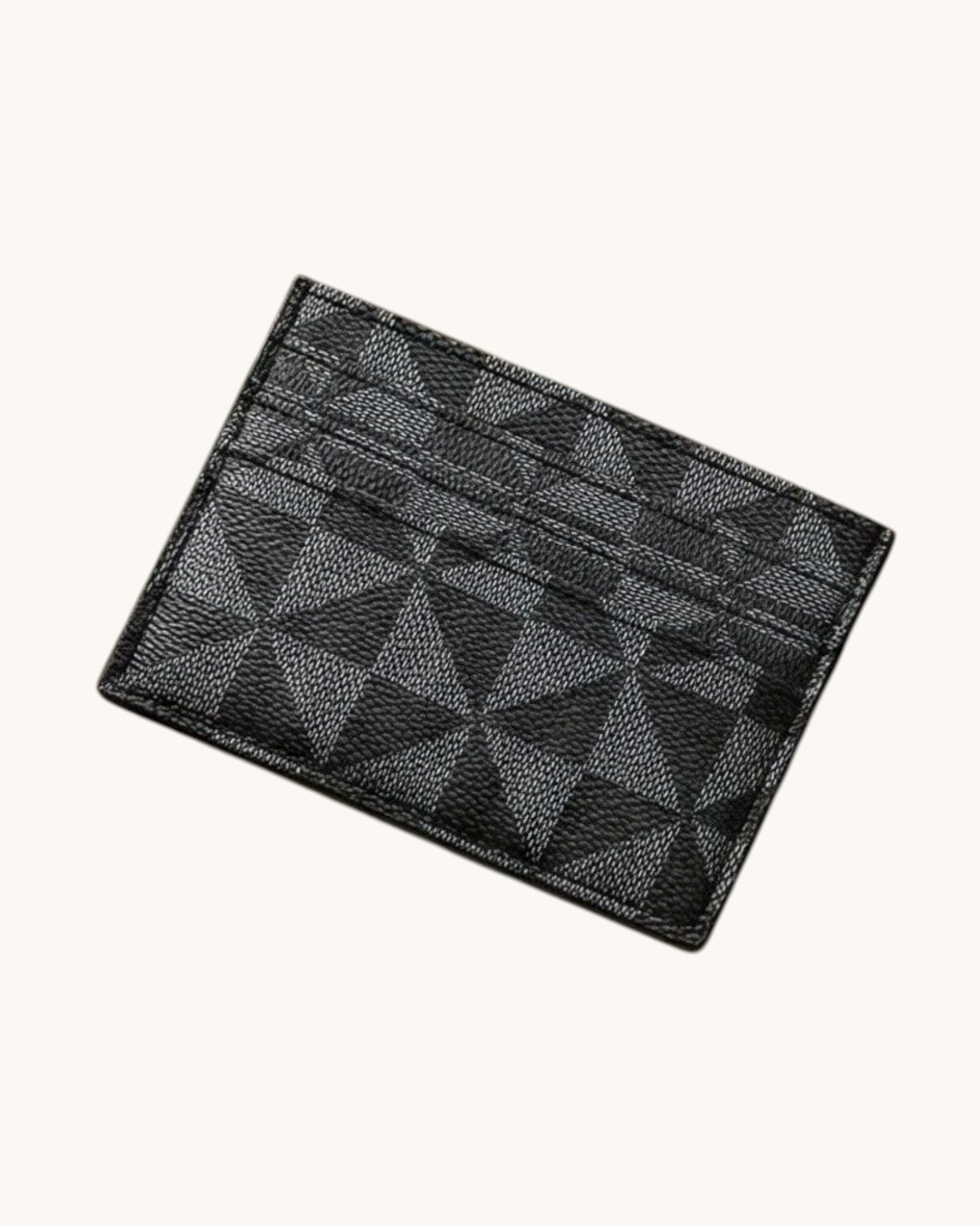 Black textured cardholder on a white background.