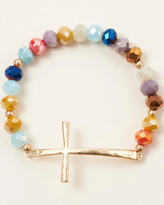 Multi-color glass bead stretch bracelet featuring a hammered gold cross charm, symbolic and stylish for everyday wear.