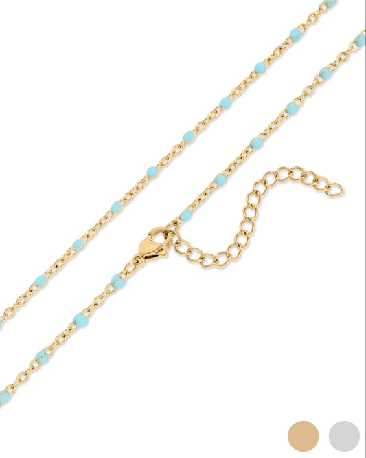 Gold chain necklace with blue beads on a white background.