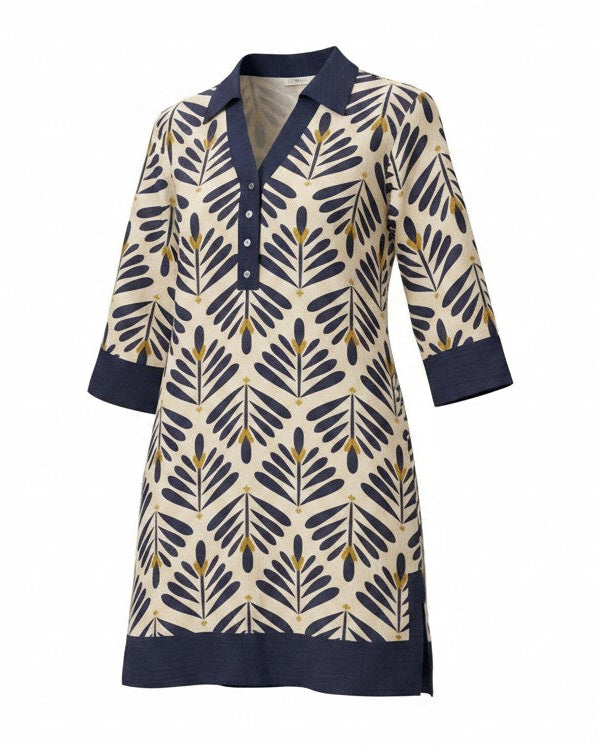 A women's three-quarter sleeve tunic dress featuring a navy blue and beige geometric leaf pattern with solid navy trim on the collar, cuffs, and hem.