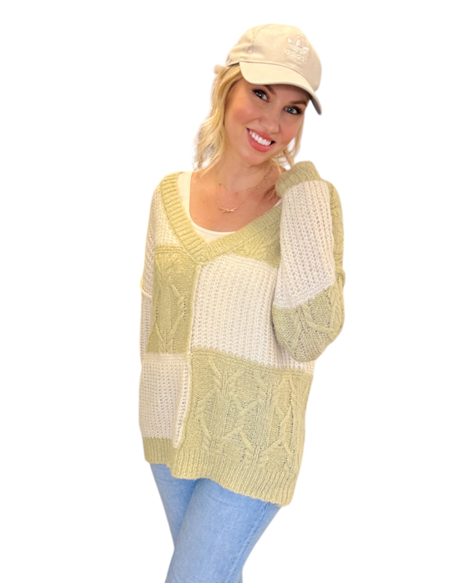 Super Soft Light Sage and Cream Color Block Sweater with a V-neckline, long sleeves, and a relaxed fit in soft knit fabric, perfect for layering or standalone wear.